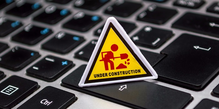 Slow Running Software Under Construction sign placed on shift.