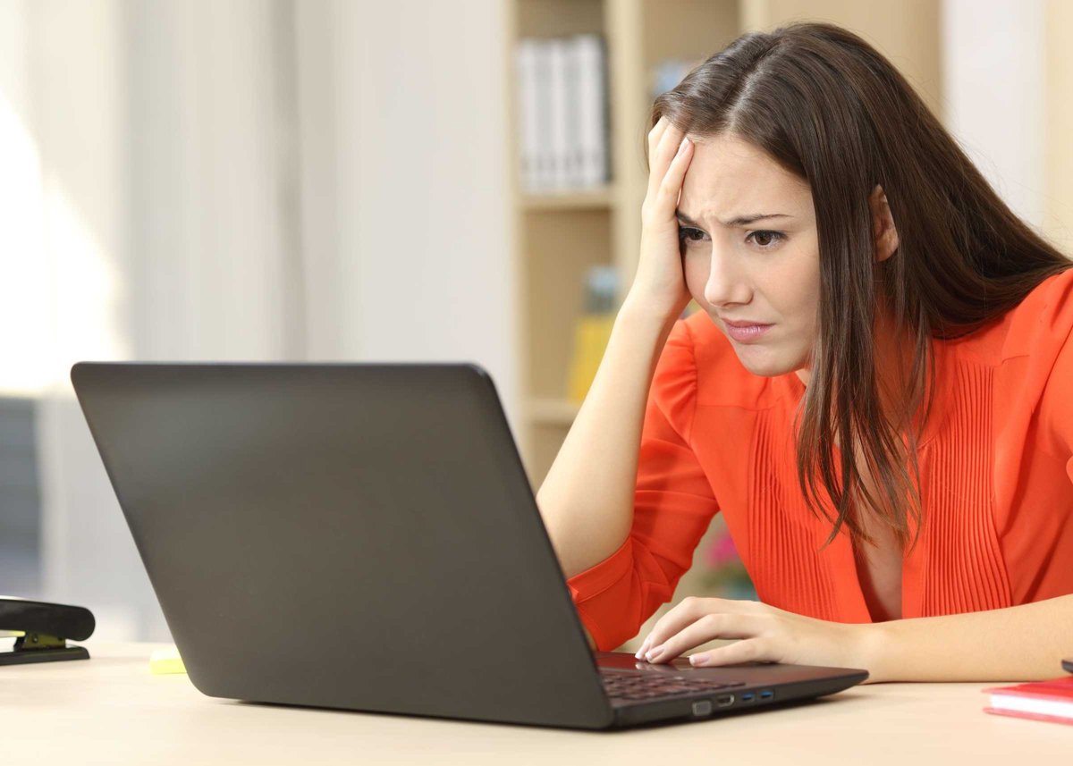 Sad and worried entrepreneur with laptop