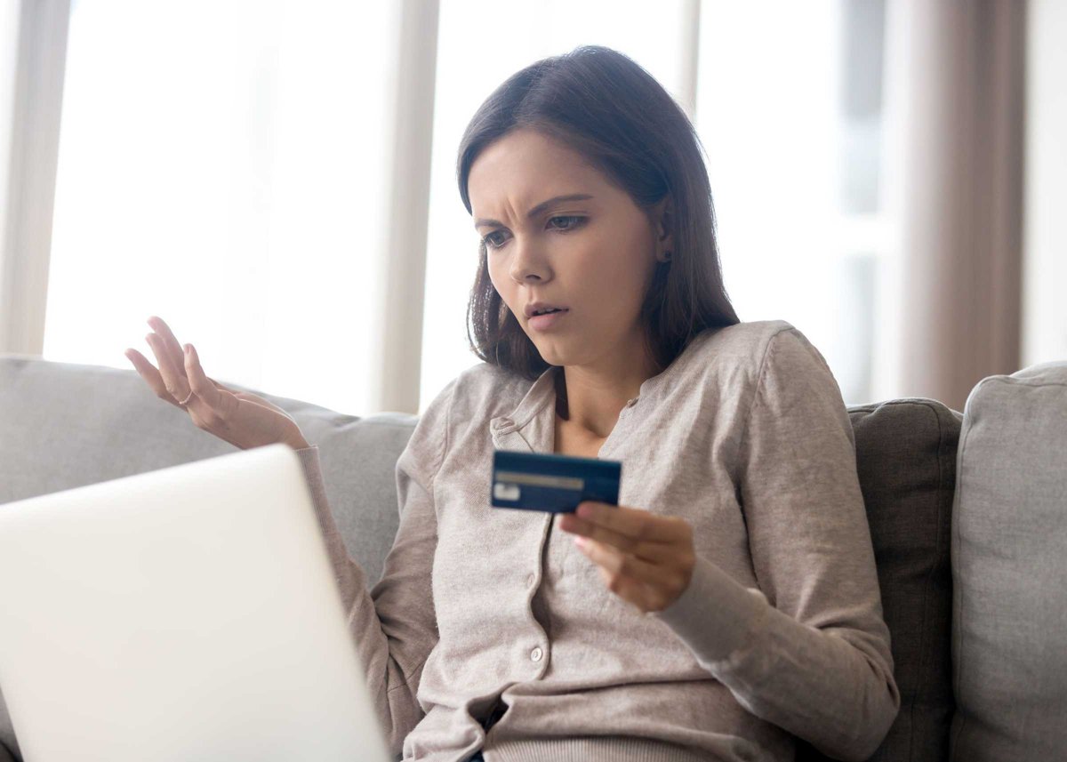 Woman using online banking having problem with blocked credit card