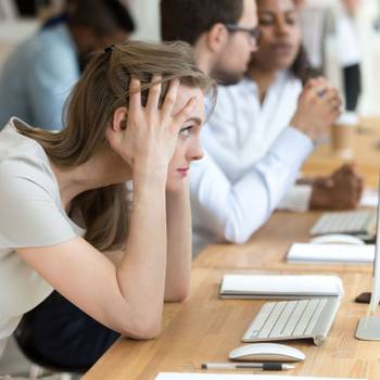 Stressed female employee having computer problem at work